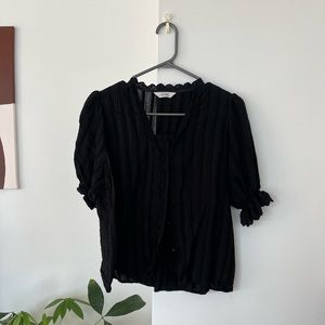 French vintage style v-neck black blouse with puff sleeves and lace edges